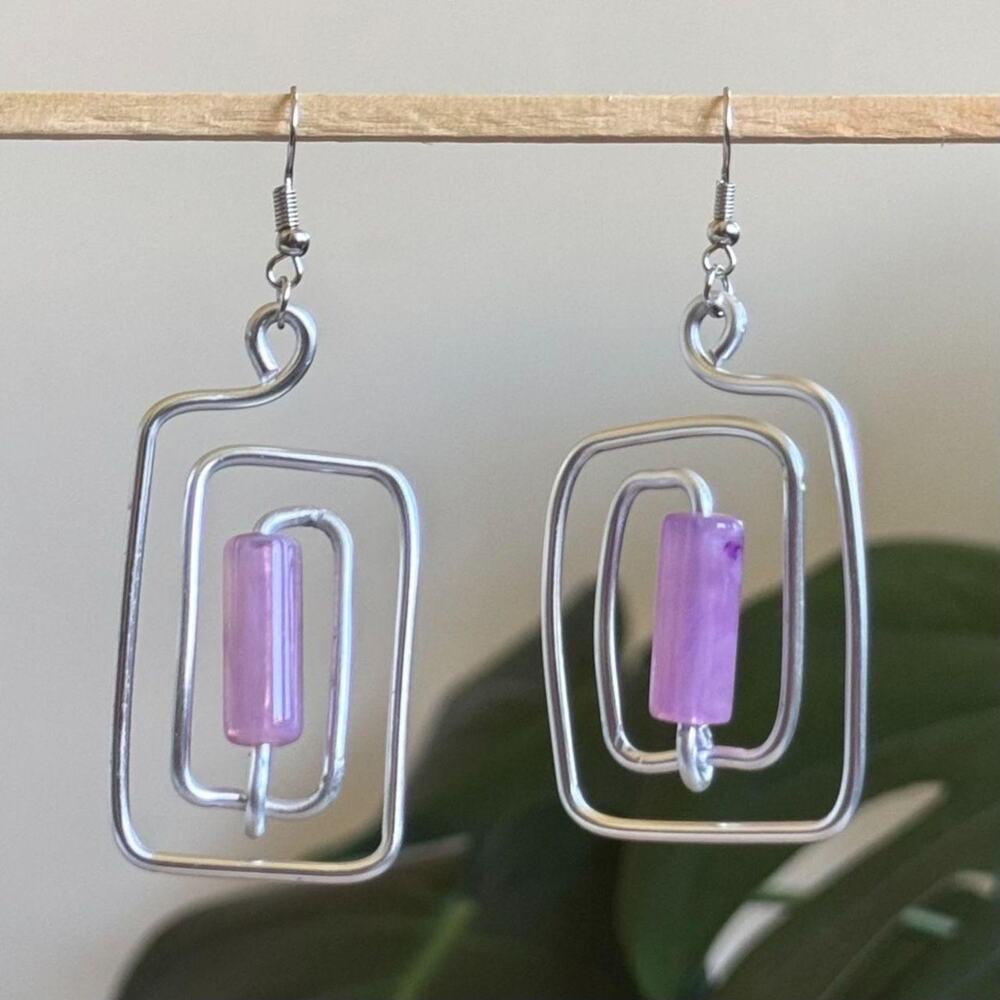 handmade silver wire spiral earrings with lilac purple colored tube beads